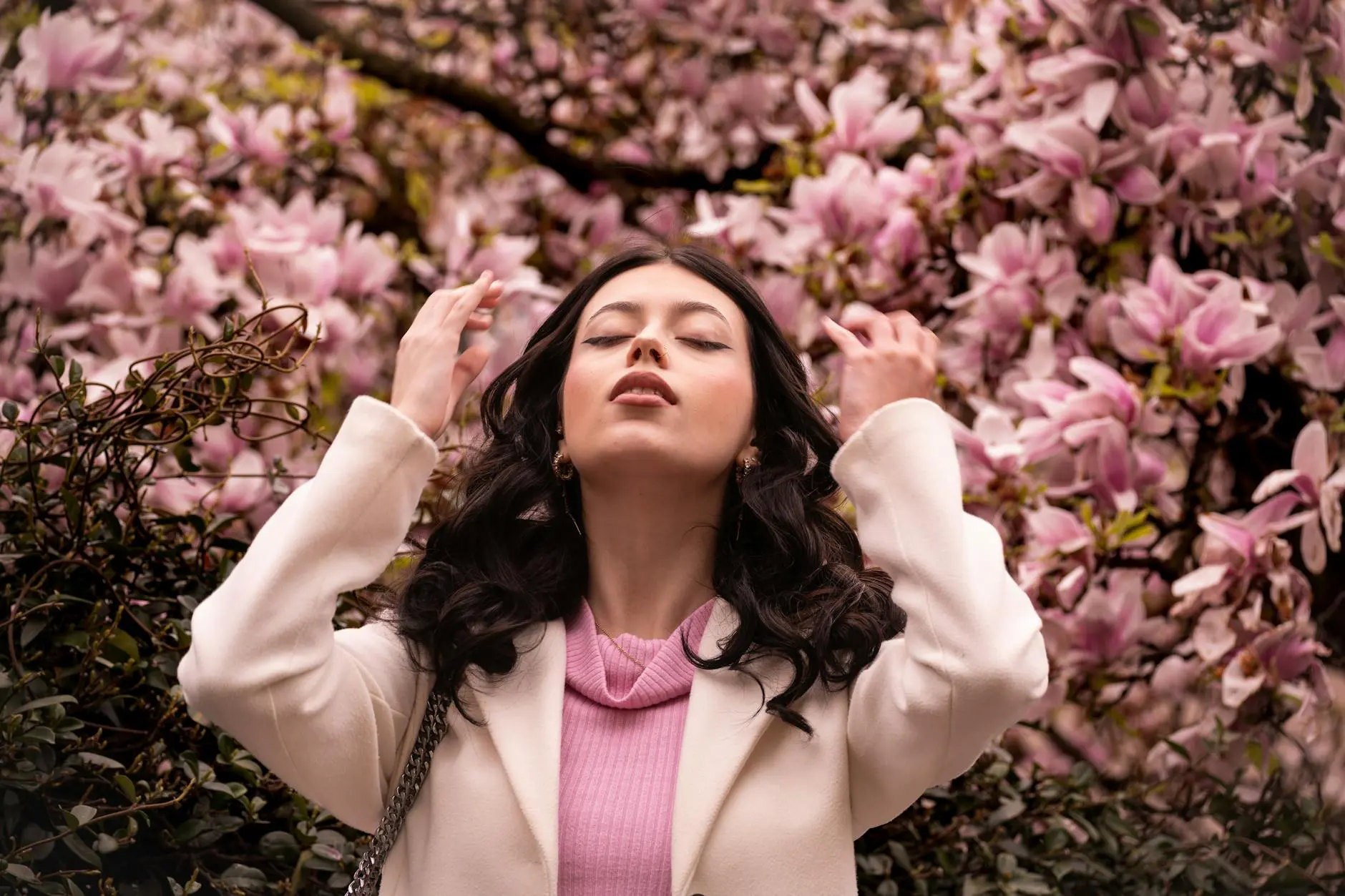 woman enjoying spring blossoms in milano