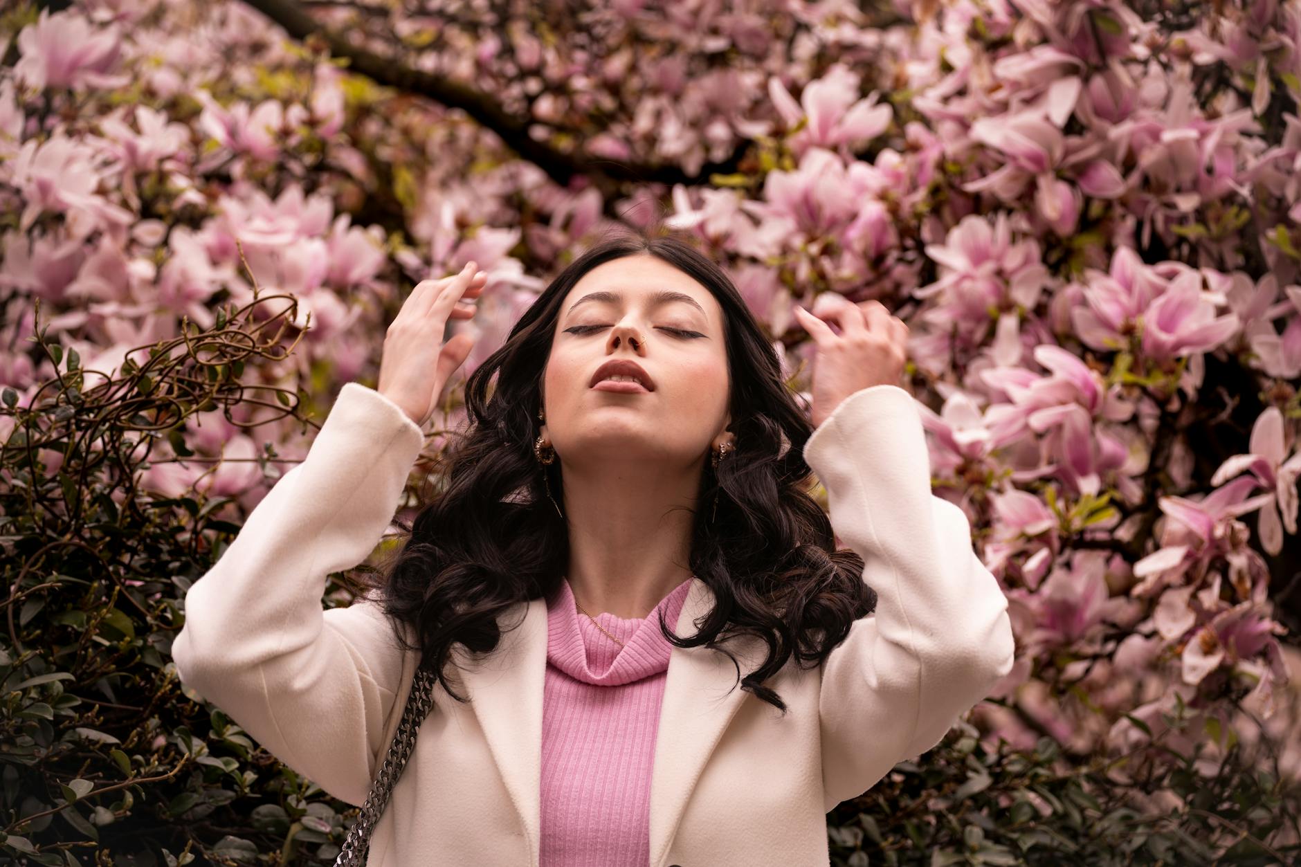 woman enjoying spring blossoms in milano
